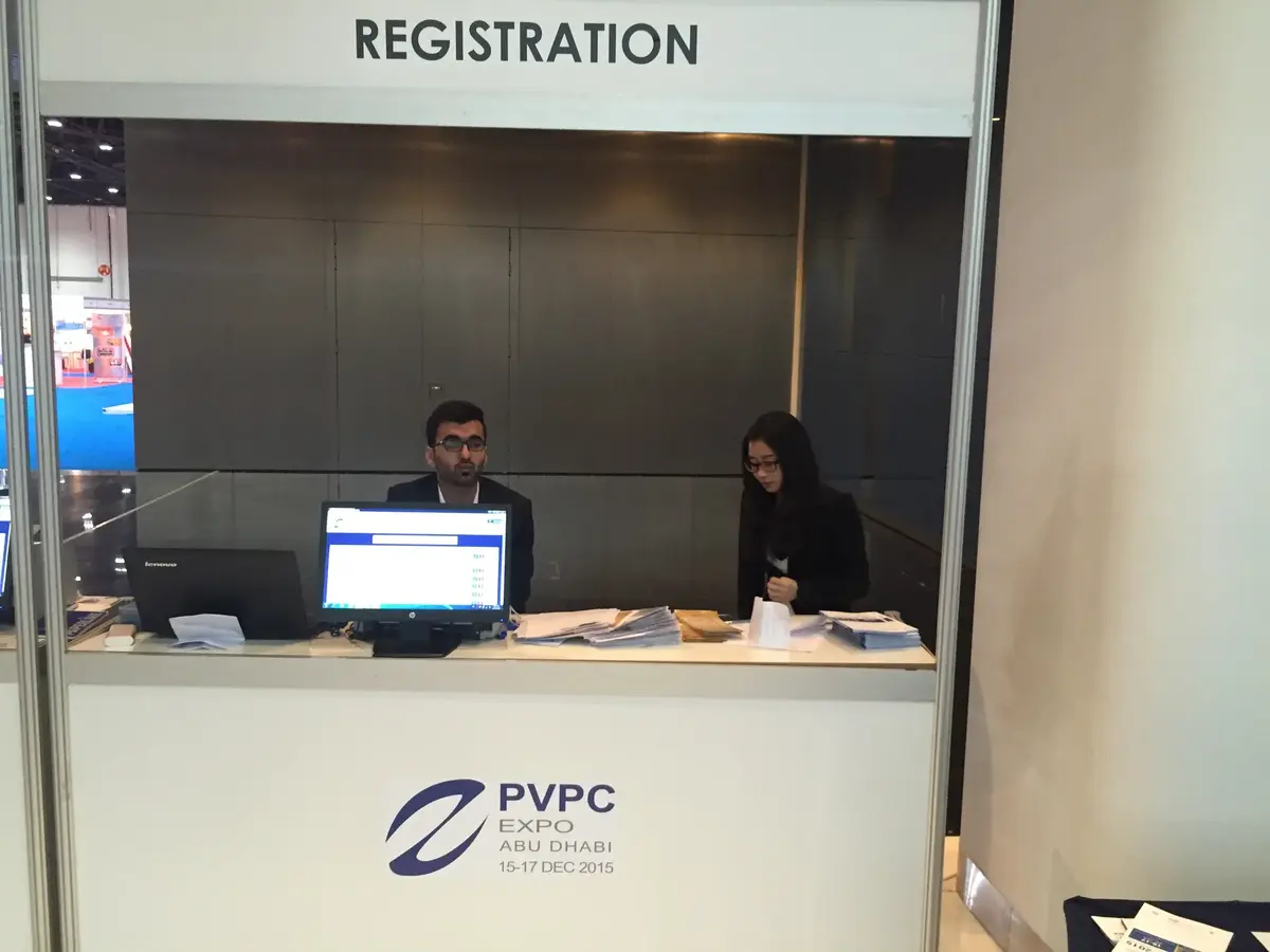 Professional event registration desk at corporate conference Dubai